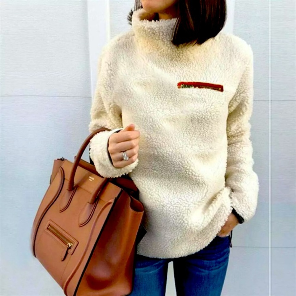 Woman’s light weight cream Sherpa pullover